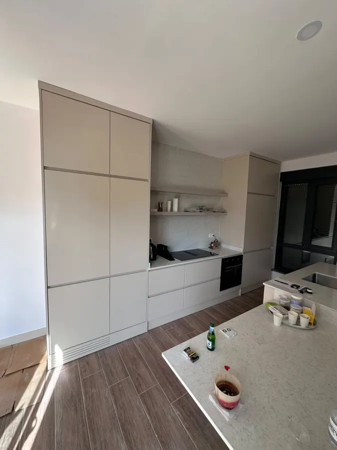 Beige minimal kitchen with island worktop