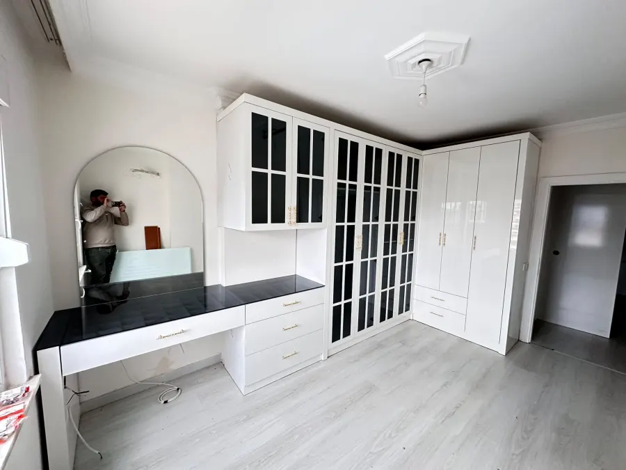 White country wardrobe and dressing table with arched mirror