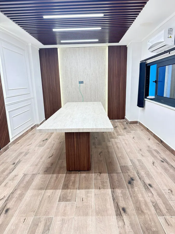 Bespoke meeting table with a travertine top